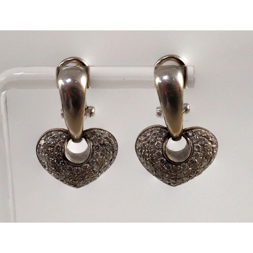 453 - A modern pair of Italian 18ct white gold and pave set diamond heart shaped earrings, by Chimento, ov... 