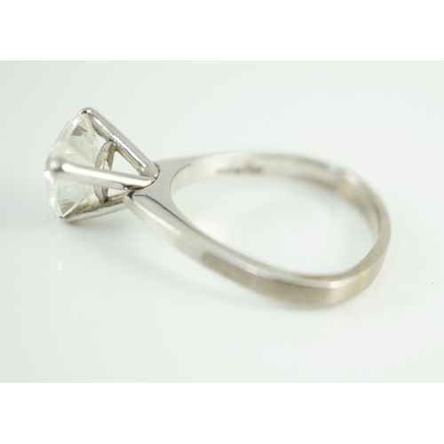 458 - A modern platinum and solitaire trillion cut diamond set ring, the shaped shank stamped Yau Wing, th... 