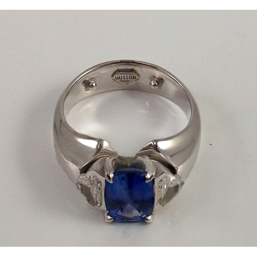 466 - A modern white gold (tests as 18ct),  single stone oval cut Ceylon sapphire and two stone shield cut... 