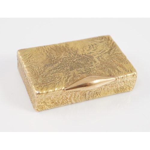 472 - A 1960's 9ct gold Cartier rectangular pill box, with samorodok decoration, signed Cartier, London an... 