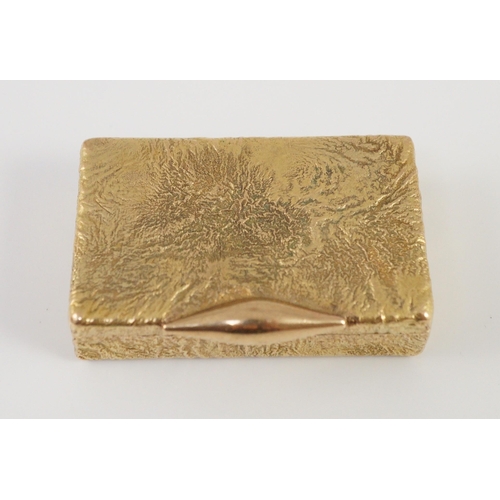 472 - A 1960's 9ct gold Cartier rectangular pill box, with samorodok decoration, signed Cartier, London an... 