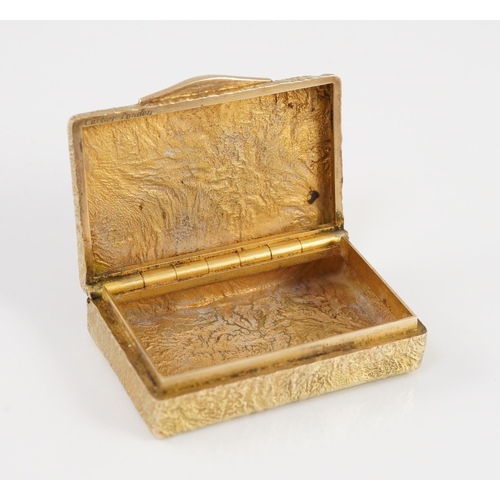 472 - A 1960's 9ct gold Cartier rectangular pill box, with samorodok decoration, signed Cartier, London an... 