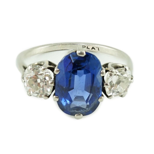 473 - A mid 20th century platinum, single stone oval cut sapphire and two stone cushion cut diamond set dr... 