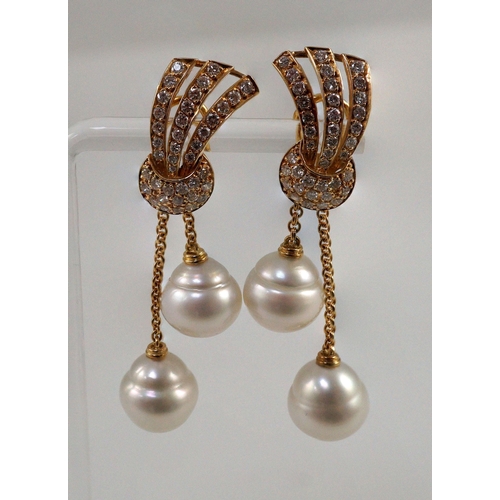 479 - A modern pair of gold (tests as 18ct) and two stone South Sea pearl and diamond cluster set double d... 