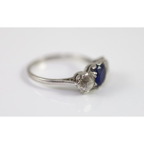 486 - A platinum two stone diamond and single stone sapphire ring, the total diamond weight approximately ... 