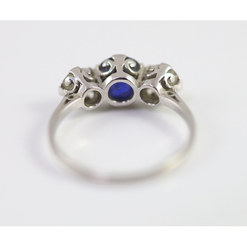 486 - A platinum two stone diamond and single stone sapphire ring, the total diamond weight approximately ... 