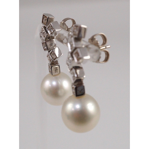 487 - A modern pair of 18ct white gold, single stone South Sea pearl and eight stone diamond cluster set d... 