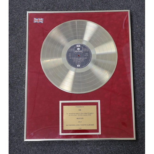 5 - Sgt. Peppers Lonely Hearts Club Band, a framed gold disc, presented to EMI to recognise sales in the... 