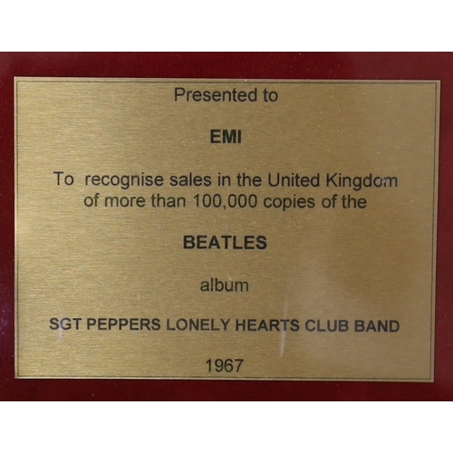 5 - Sgt. Peppers Lonely Hearts Club Band, a framed gold disc, presented to EMI to recognise sales in the... 