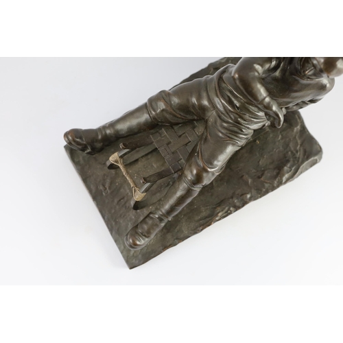 53 - A late 19th / early 20th century German bronze model of a tobogganist, on naturalistic base, inscrib... 