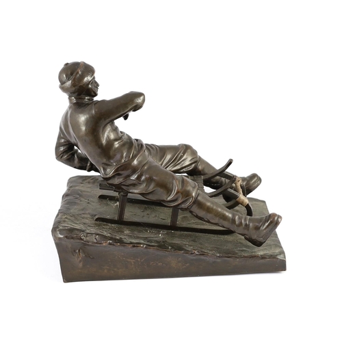 53 - A late 19th / early 20th century German bronze model of a tobogganist, on naturalistic base, inscrib... 