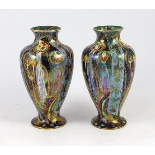 60 - N.B. RESTORATION TO ONE VASE. A pair of Wedgwood ’Candlemas’ Fairyland lustre vases, designed by Dai... 