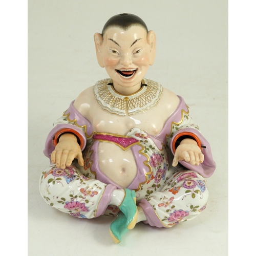 75 - A Meissen figure of a nodding chinaman, 19th century, with weighted nodding head, moving tongue and ... 