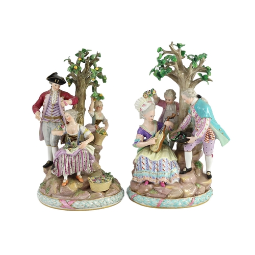 76 - A pair of Meissen groups of apple pickers and flower gatherers, 19th century, blue crossed swords ma... 