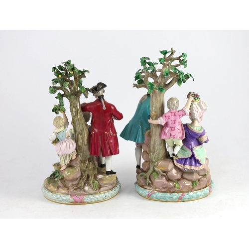 76 - A pair of Meissen groups of apple pickers and flower gatherers, 19th century, blue crossed swords ma... 