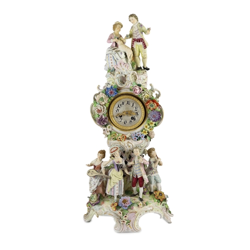 77 - An impressive German porcelain floral encrusted figural mantel clock, late 19th century, modelled wi... 