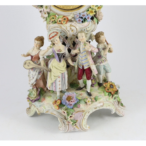 77 - An impressive German porcelain floral encrusted figural mantel clock, late 19th century, modelled wi... 