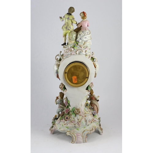 77 - An impressive German porcelain floral encrusted figural mantel clock, late 19th century, modelled wi... 