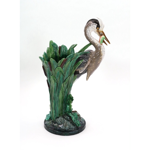 79 - A Minton majolica life-size heron stickstand, initialled J.H. for the modeller John Henk, c.1905, ... 