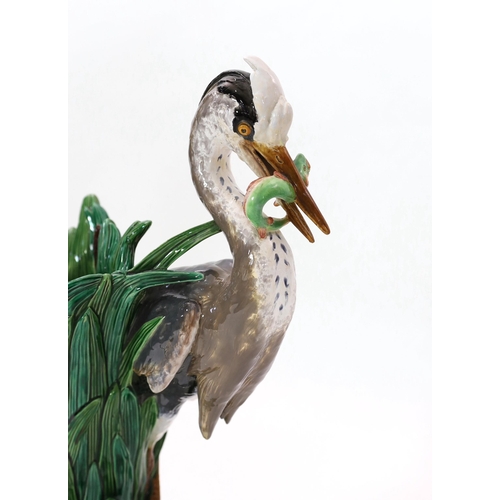 79 - A Minton majolica life-size heron stickstand, initialled J.H. for the modeller John Henk, c.1905, ... 