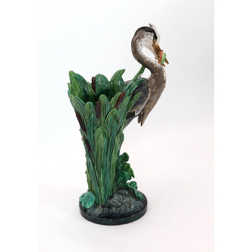 79 - A Minton majolica life-size heron stickstand, initialled J.H. for the modeller John Henk, c.1905, ... 