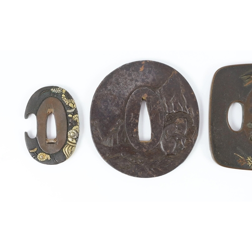 92 - A group of Japanese bronze, iron and mixed metal tsuba and a kozuka knife handle, 19th century, comp... 