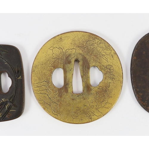 92 - A group of Japanese bronze, iron and mixed metal tsuba and a kozuka knife handle, 19th century, comp... 