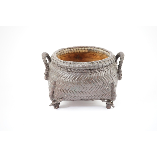 95 - A Japanese bronze koro, 19th century, cast in imitation of a takezaiku bamboo basket, applied with a... 