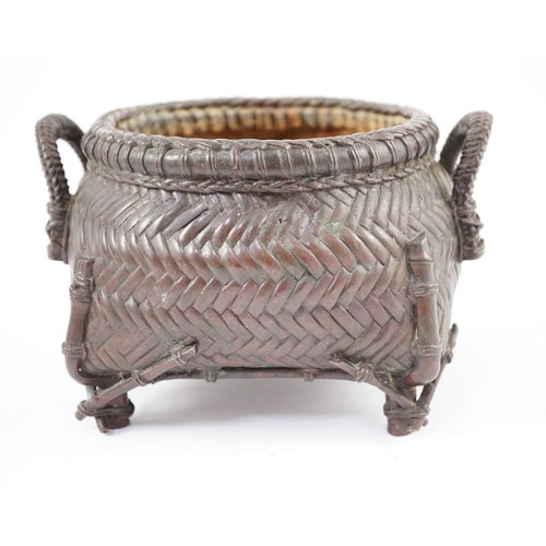 95 - A Japanese bronze koro, 19th century, cast in imitation of a takezaiku bamboo basket, applied with a... 