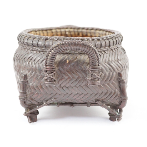 95 - A Japanese bronze koro, 19th century, cast in imitation of a takezaiku bamboo basket, applied with a... 