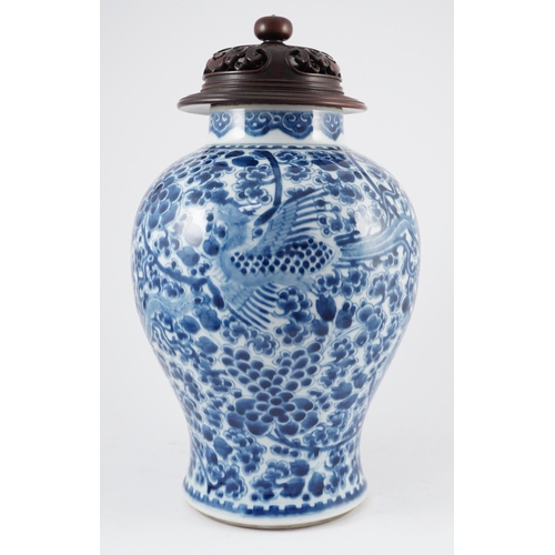 98 - A Chinese blue and white phoenix and peony baluster jar, Kangxi period, with a later wood cover, P... 