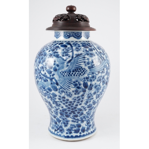 98 - A Chinese blue and white phoenix and peony baluster jar, Kangxi period, with a later wood cover, P... 