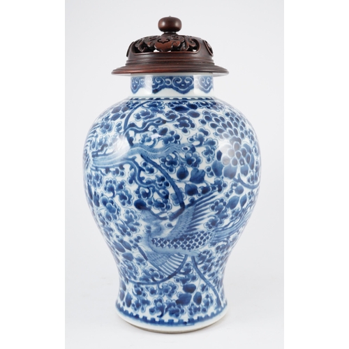 98 - A Chinese blue and white phoenix and peony baluster jar, Kangxi period, with a later wood cover, P... 