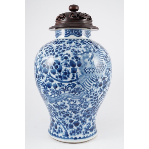 98 - A Chinese blue and white phoenix and peony baluster jar, Kangxi period, with a later wood cover, P... 