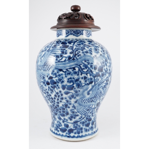 98 - A Chinese blue and white phoenix and peony baluster jar, Kangxi period, with a later wood cover, P... 