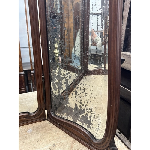 2014 - An early 20th century French carved walnut folding triple dressing table mirror, height 106cm