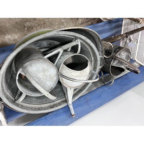 2021 - Ten assorted galvanised watering cans and containers, largest width 86cm