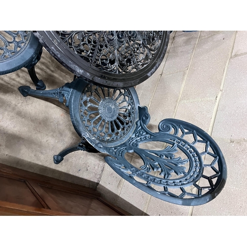 2024 - A Victorian style aluminium circular garden table, diameter 60cm, height 62cm and four chairs