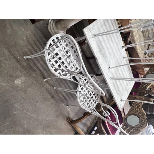 2045 - A set of four painted wrought iron garden chairs, height 96cm