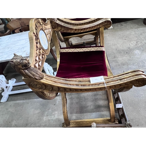 2047 - A pair of Renaissance style giltwood and composition X frame elbow chairs, on lion's paw feet, width... 