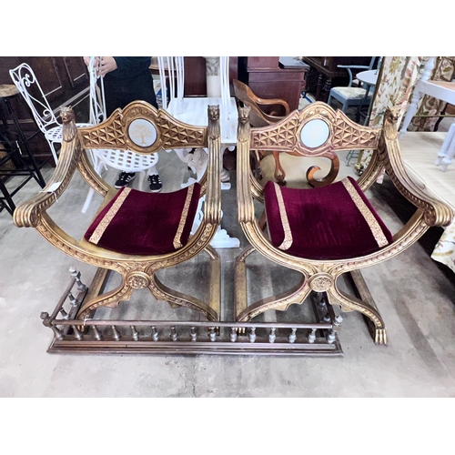 2047 - A pair of Renaissance style giltwood and composition X frame elbow chairs, on lion's paw feet, width... 