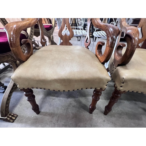 2049 - A pair of Victorian walnut elbow chairs with light brown leather seats, width 59cm, depth 51cm, heig... 