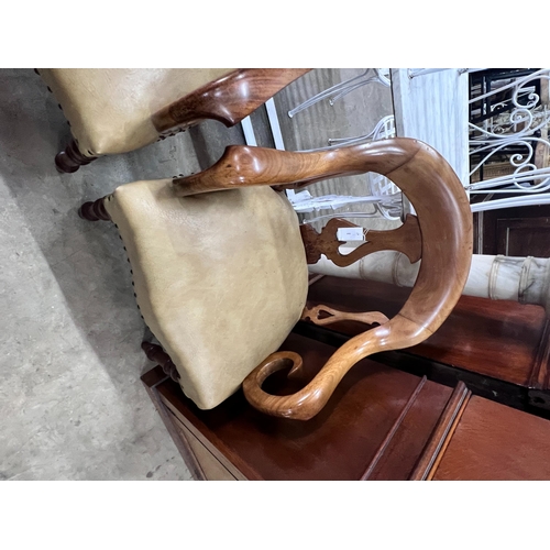 2049 - A pair of Victorian walnut elbow chairs with light brown leather seats, width 59cm, depth 51cm, heig... 