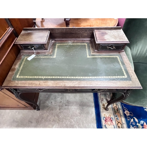 2051 - A late Victorian carved mahogany writing desk, length 99cm, depth 58cm, height 88cm