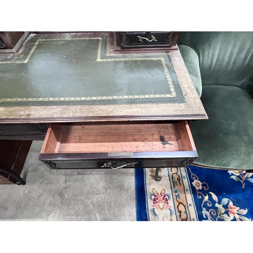 2051 - A late Victorian carved mahogany writing desk, length 99cm, depth 58cm, height 88cm