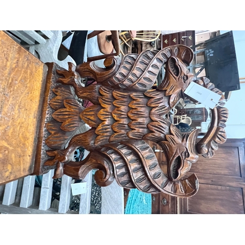 2057 - A pair of Victorian carved oak hall chairs with carved twin eagle backs, width 44cm, depth 40cm, hei... 