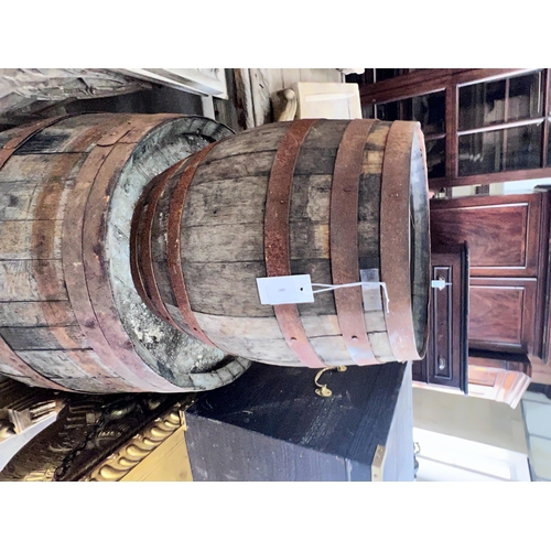 2087 - Three iron bound staved wood barrels, largest height 98cm