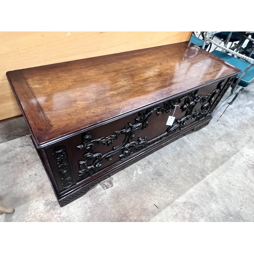 2106 - An 18th century style walnut coffer with carved applied front, width 140cm, depth 53cm, height 49cm... 