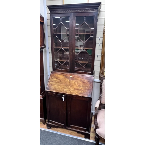 2159 - A George III mahogany bureau bookcase of narrow proportions with panelled cupboard base, width 77cm,... 