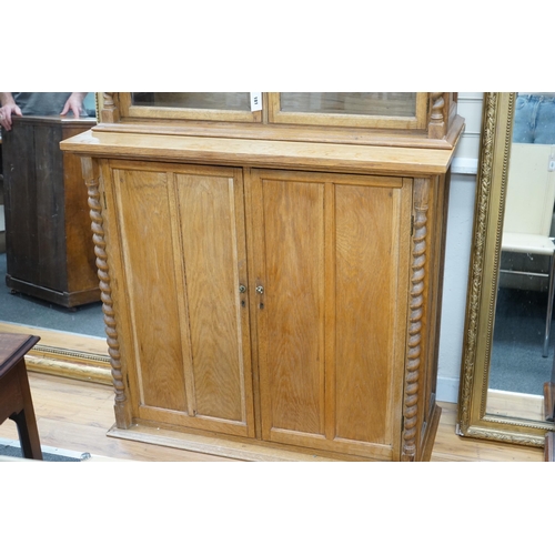 2163 - An early 20th century oak three part side cabinet, width 105cm, depth 47cm, height 188cm